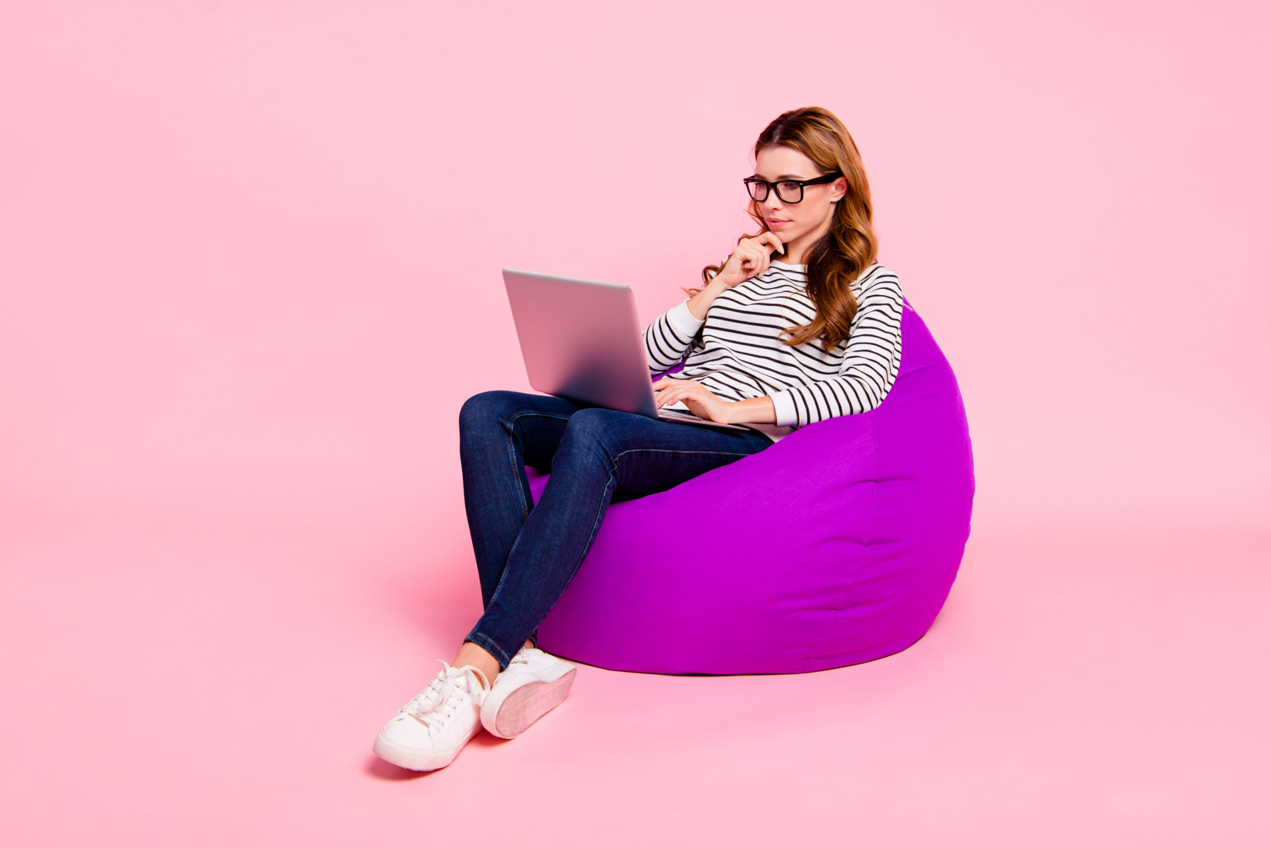 Girl on bean bag with laptop