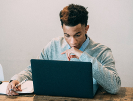 Student studying on a laptop - Learnsignal homepage